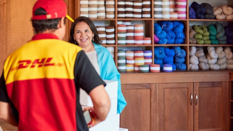 dhl express courier picking up a package of custom clothing to be delivered to Vietnam