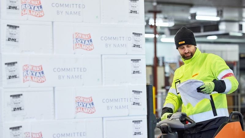 male employee checks customs documentation