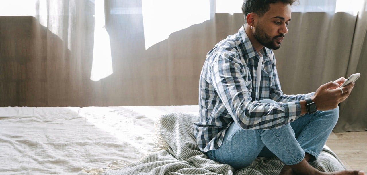 man looking at mobile screen