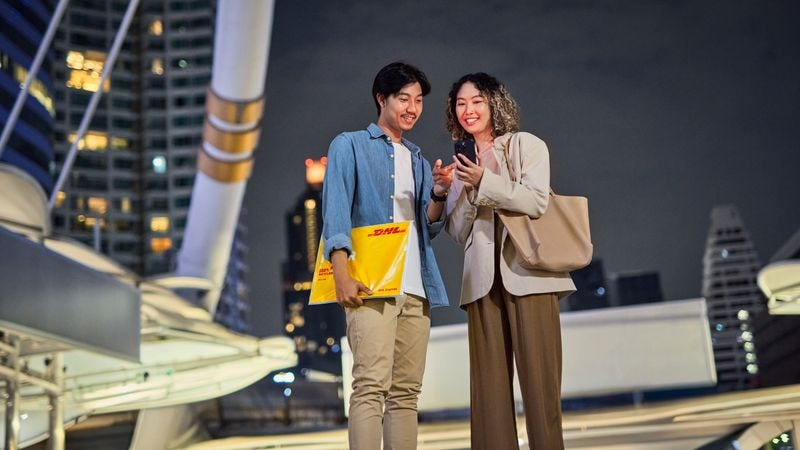 male and female customer with a DHL Express envelope
