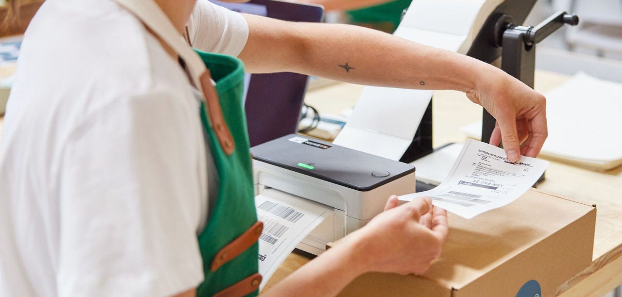 employee preparing package to be exported to South Korea