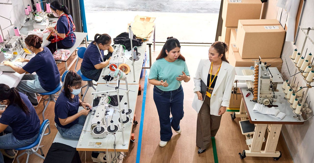 an exporter discussing hs codes for her goods with a dhl employee
