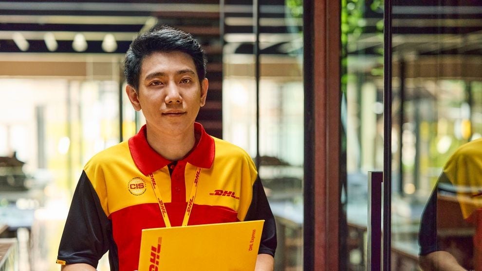 A DHL employee fulfilling an international shipping order