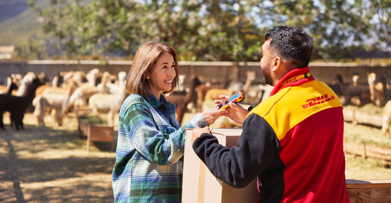 dhl courier delivering parcel to a farmer