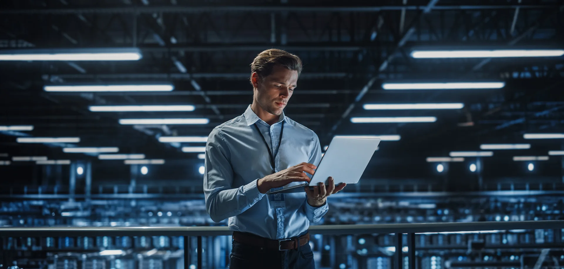 man holding a laptop