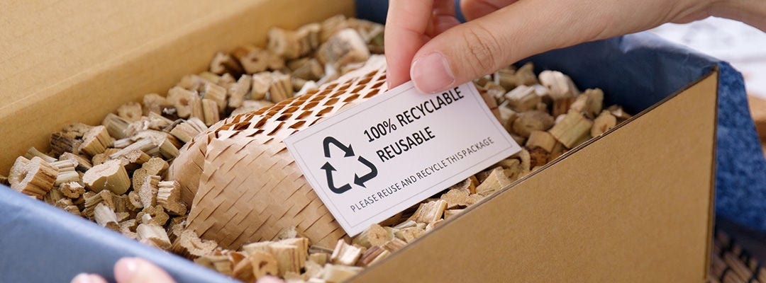 Eco vendor go green packaging parcel carton box in net zero waste store asian seller retail shop. Earth care day small SME owner asia people wrap reuse brown paper pack gift reduce plastic free order.