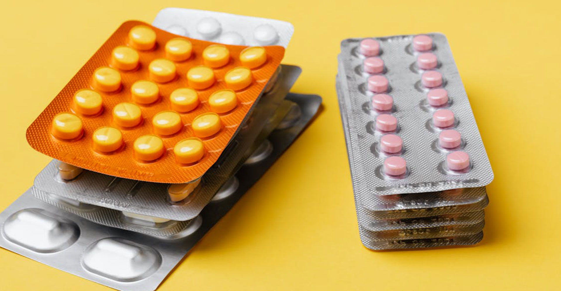 Two stacks of blister packs containing health supplements for importing to Australia