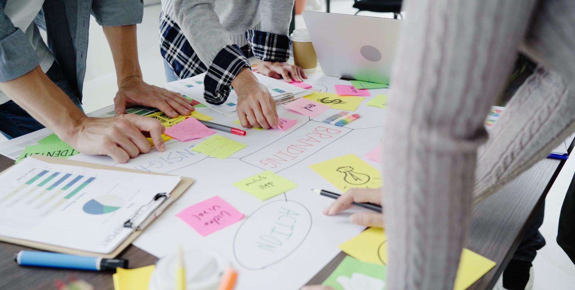a group of people brainstorming ideas for brand development