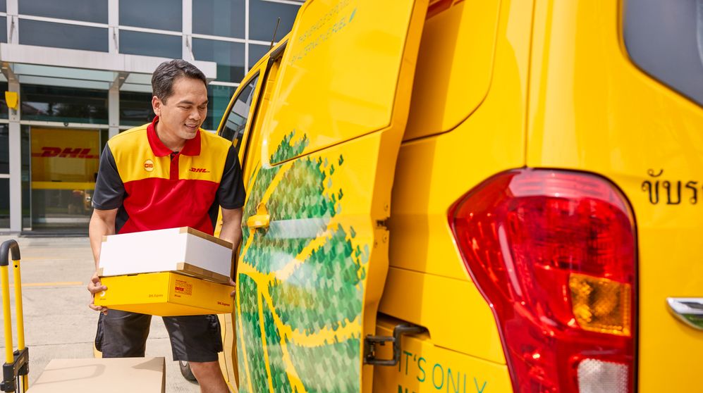 dhl employee loading parcels for export to bangladesh from india