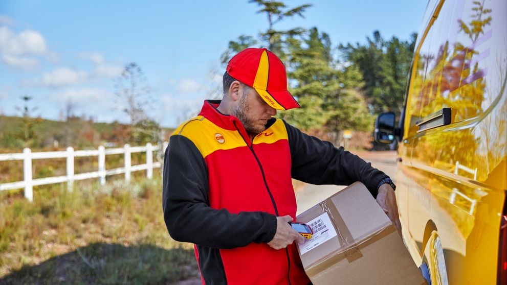 dhl express employee offering shipping services to bangladesh