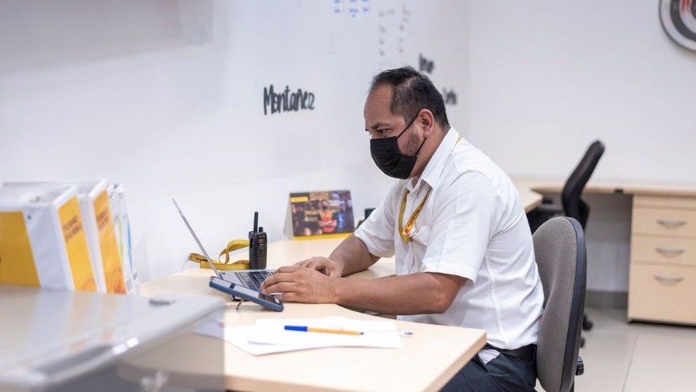 employee checking dead stock inventory on his laptop