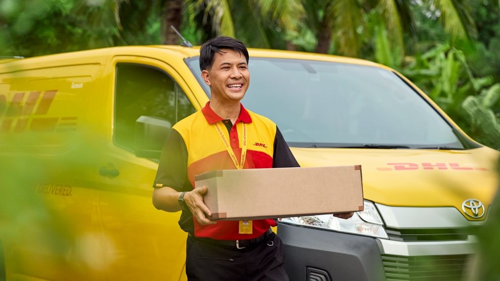 dhl express employee shipping a parcel for a small business