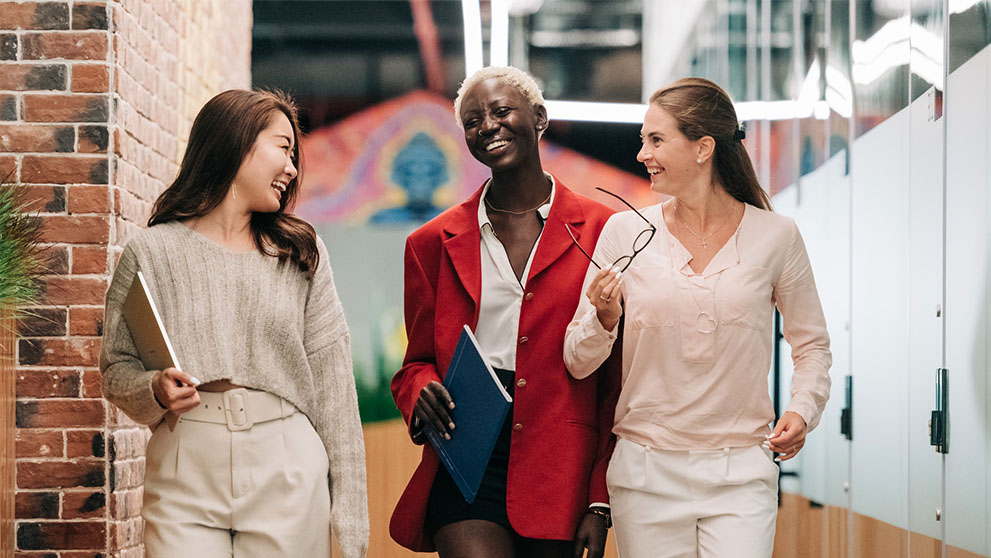 Three women smiling