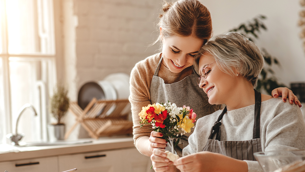 woman giving her mum flowers