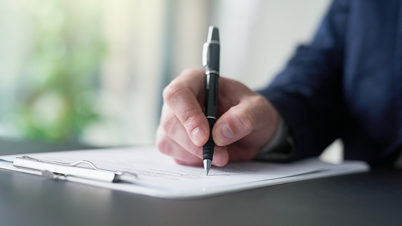 Hand, businessman and writing on document for signature for legal contract, agreement or deal for partnership as Lawyer.