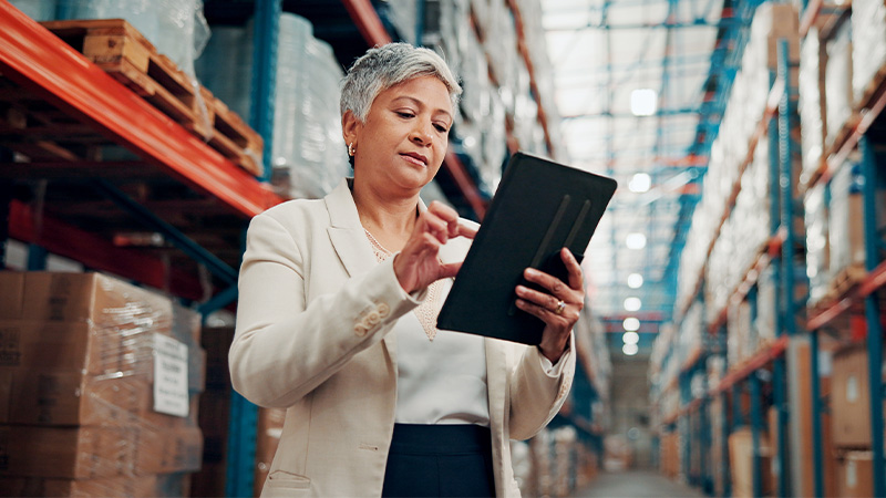 business woman swiping on a tablet screen