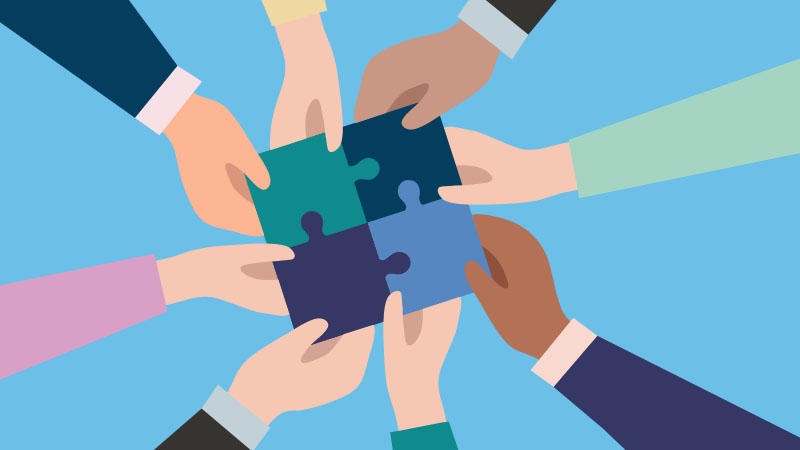 hands holding puzzle