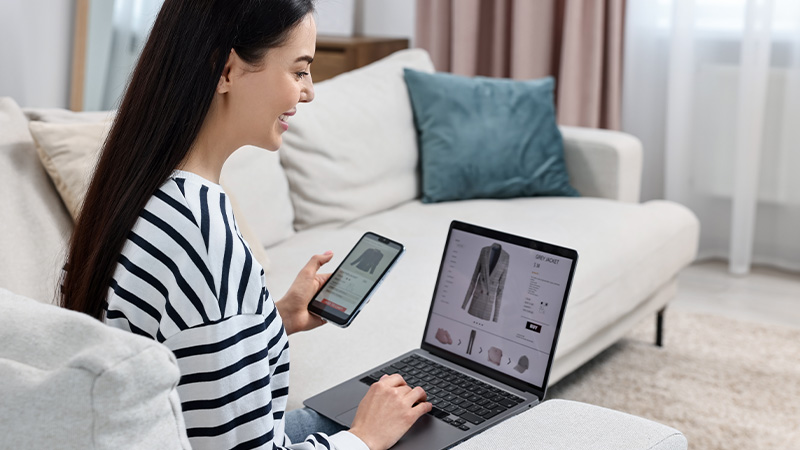 woman smiling at laptop screen