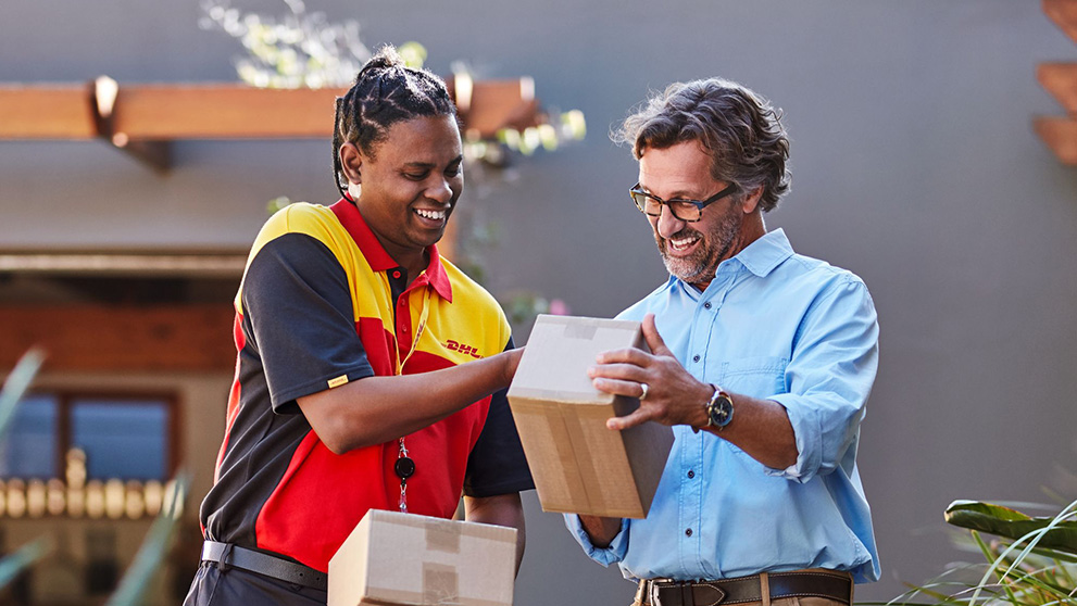 DHL courier handing a man a parcel