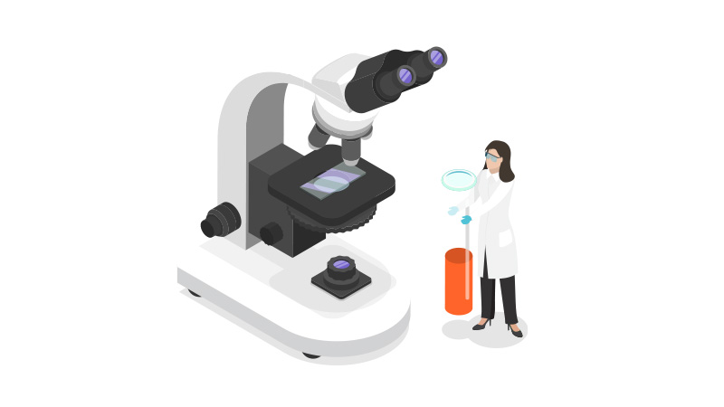woman in a lab coat and a microscope