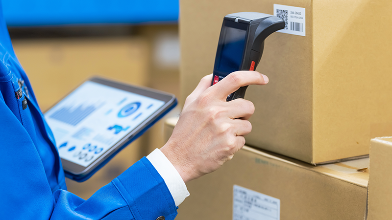 hand scanning barcode on a box