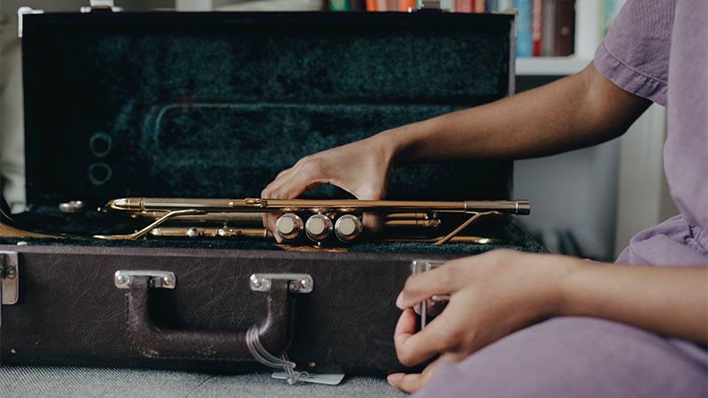 man packing flute