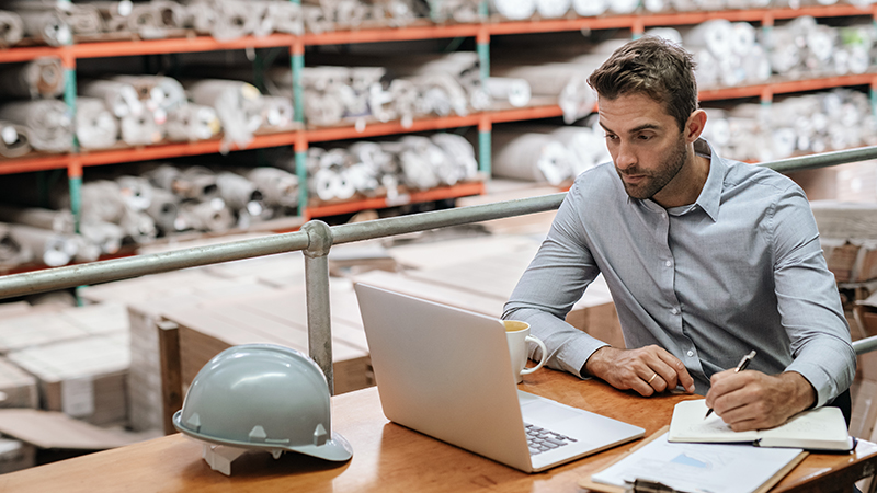 man looking at laptop screen