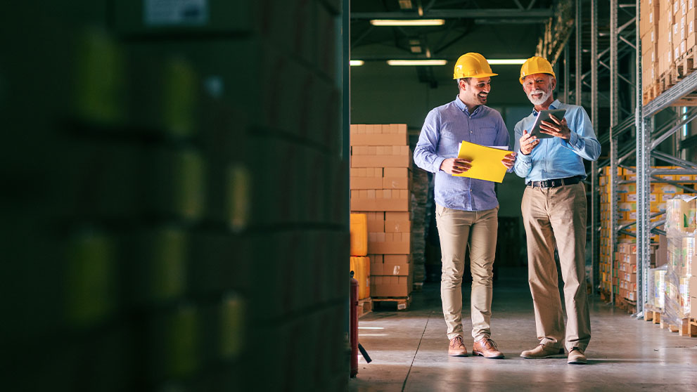 two men in a warehouse