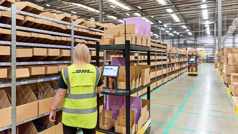 DHL employee in a warehouse