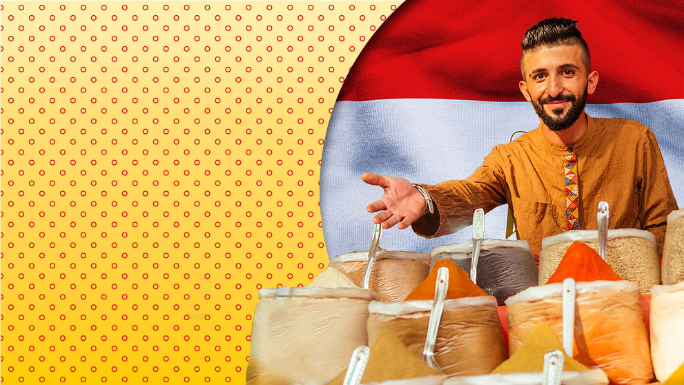 man smiling selling spices