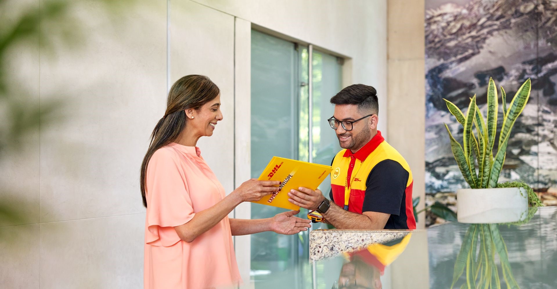 DHL Express employee completing shipping to Abu Dhabi