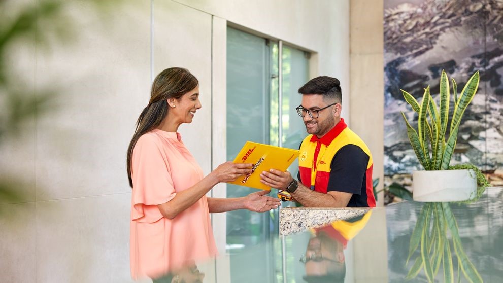 DHL Express employee completing shipping to Abu Dhabi