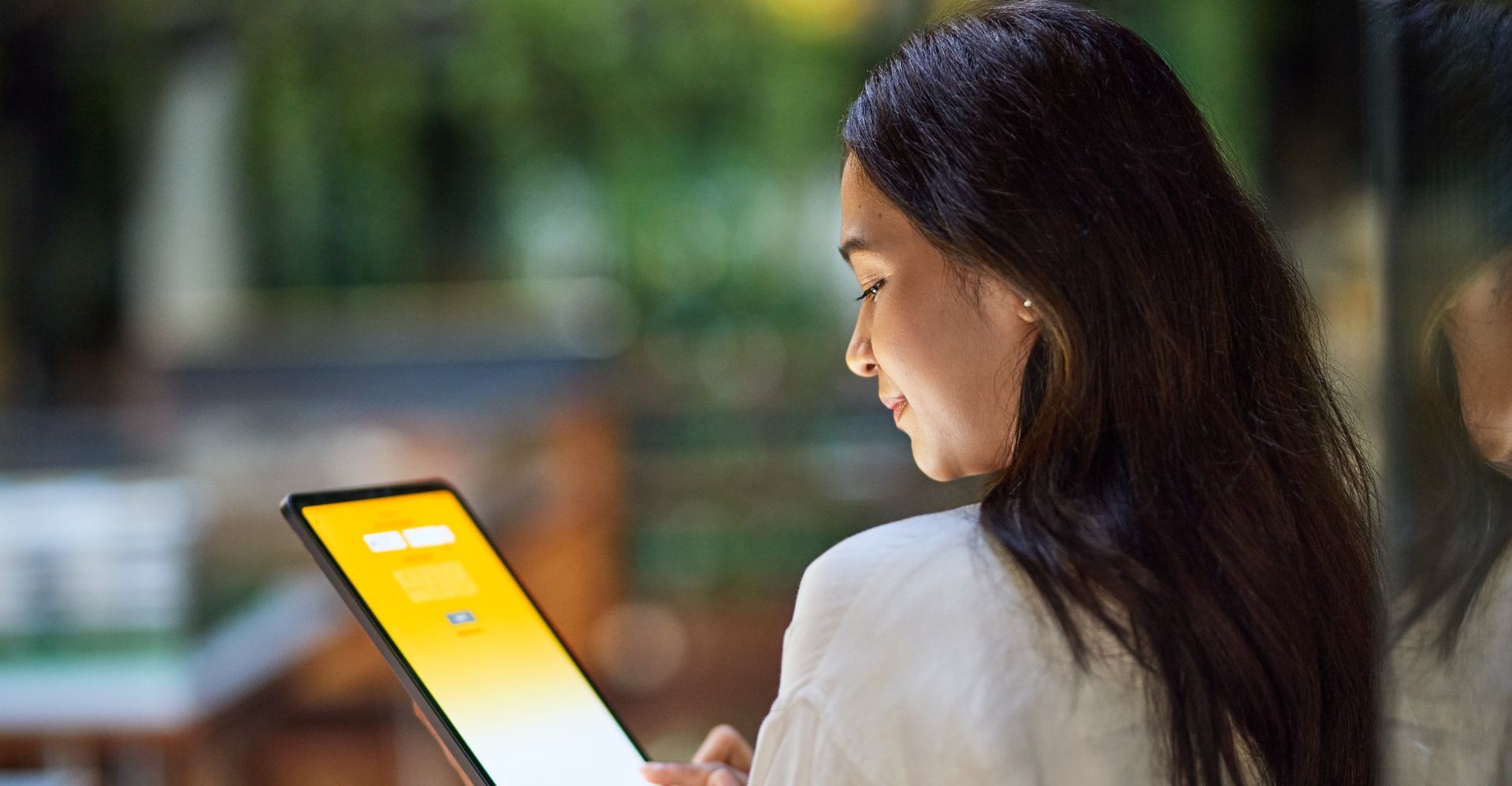 a female entrepreneur looking at her tablet