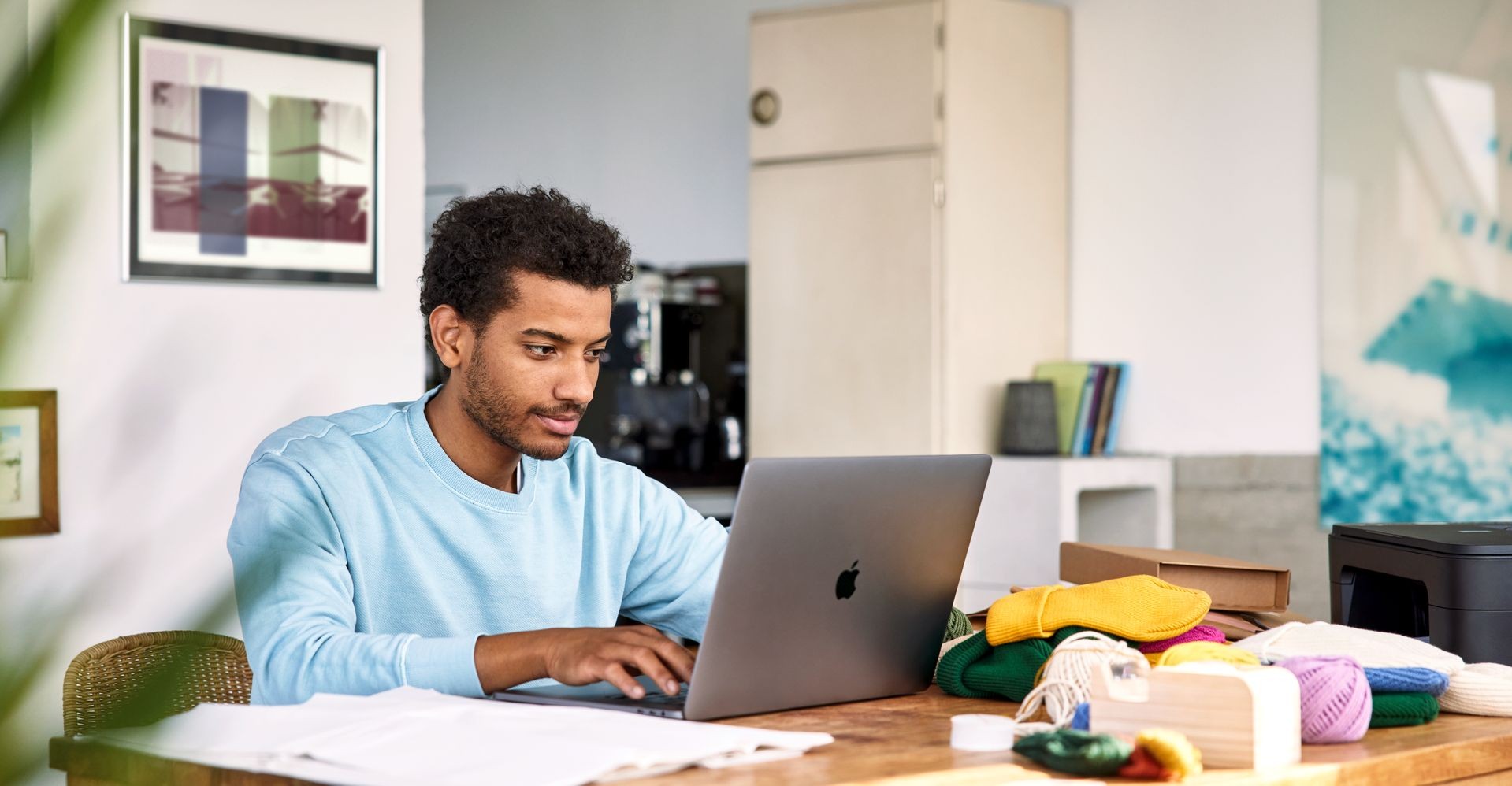 A man works on his laptop.