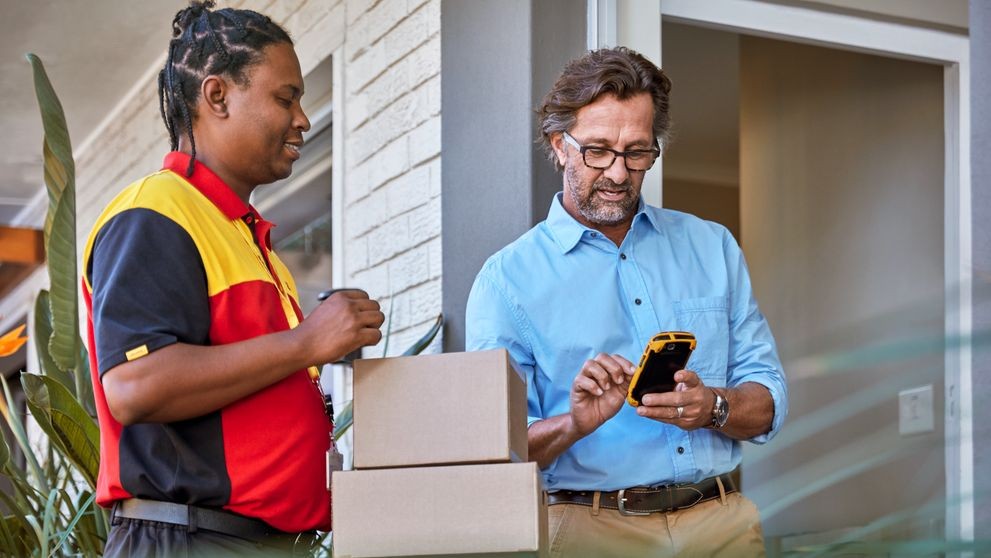 courier and customer with package showcasing international trade