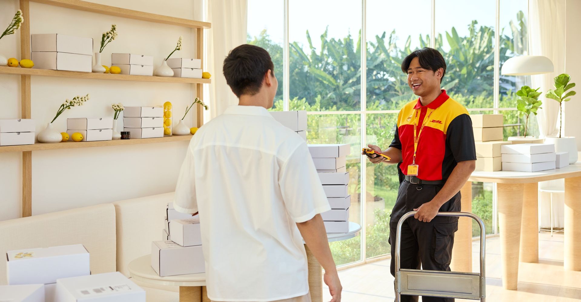 DHL employee delivering products imported from Europe to a business in Indonesia