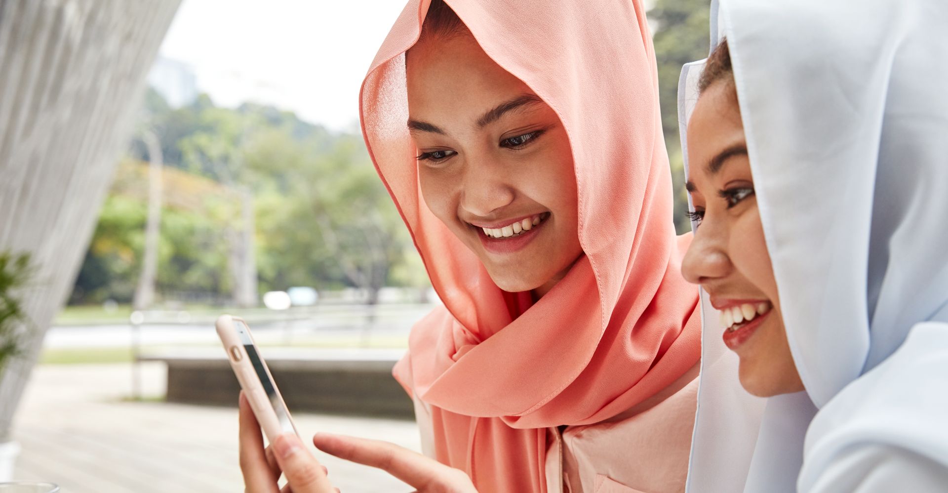 women in indonesia using a mobile phone