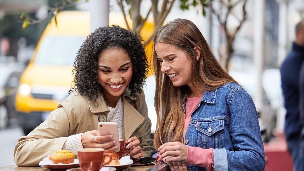 two women enjoying a cup of coffee from the best Indonesian coffee beans