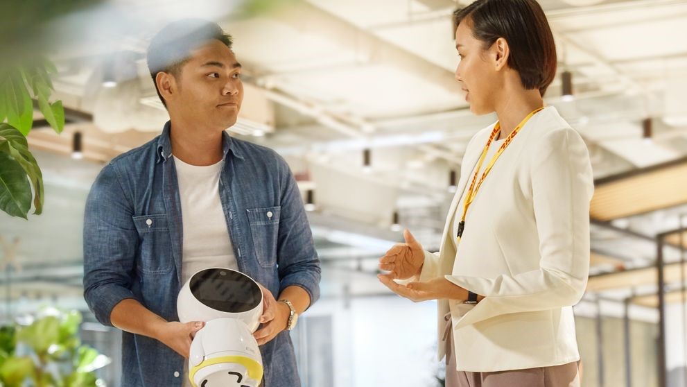 a businessman and dhl employee discussing about free trade zones in indonesia