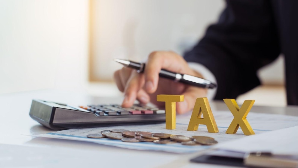 businessman calculating import duties and taxes in Indonesia