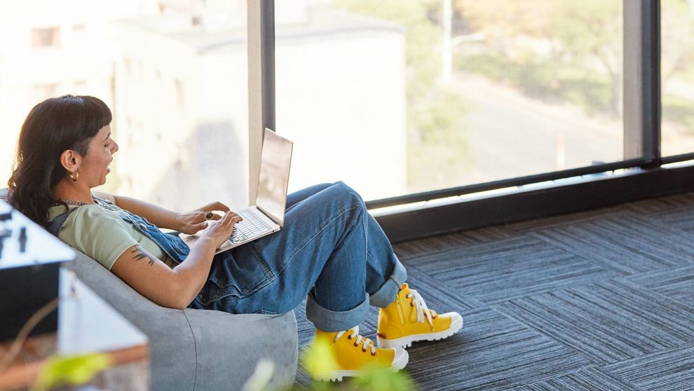 Business owner checking her invoices on DHL MyBill through her laptop