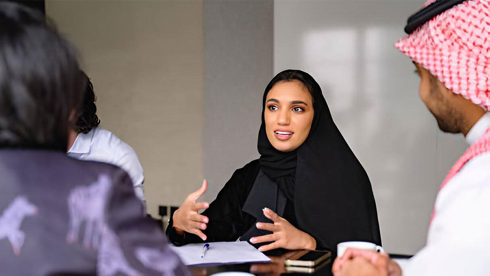 woman in modest wear discussing about expanding business