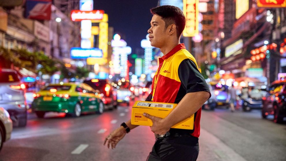 courier making delivery in city at night
