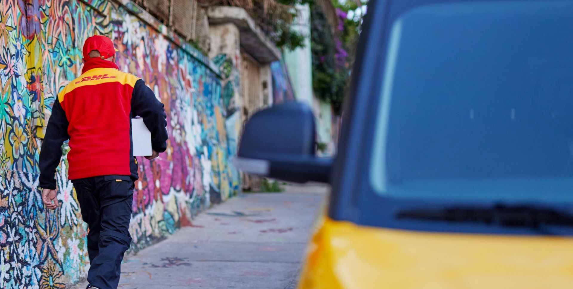 dhl staff executing fast delivery service for a confidential international package