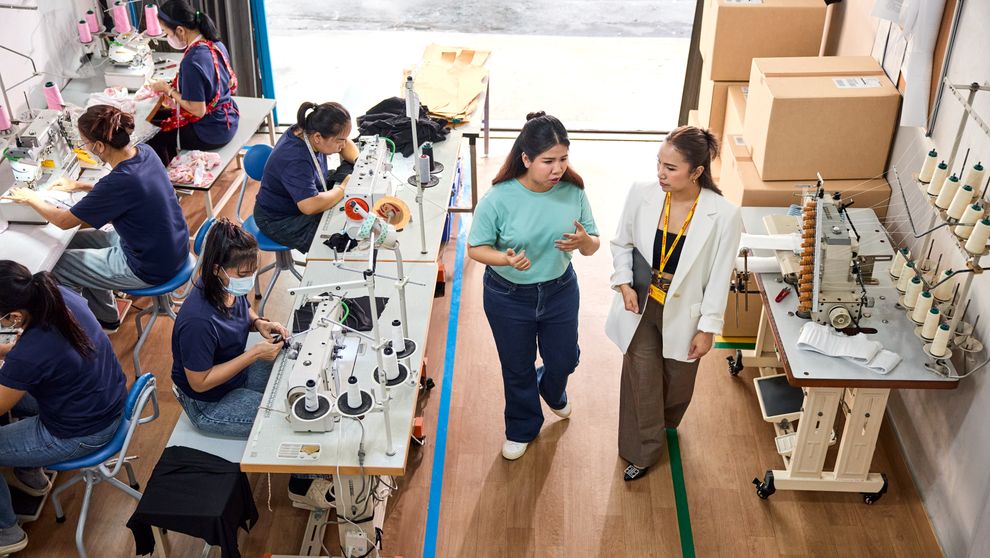 an exporter discussing hs codes for her goods with a dhl employee