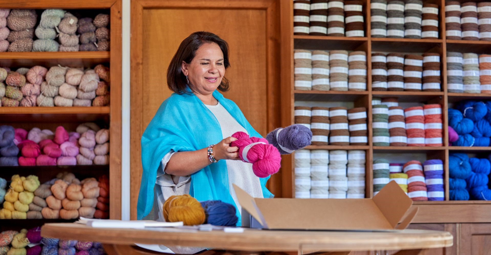 woman packing products for small business shipping