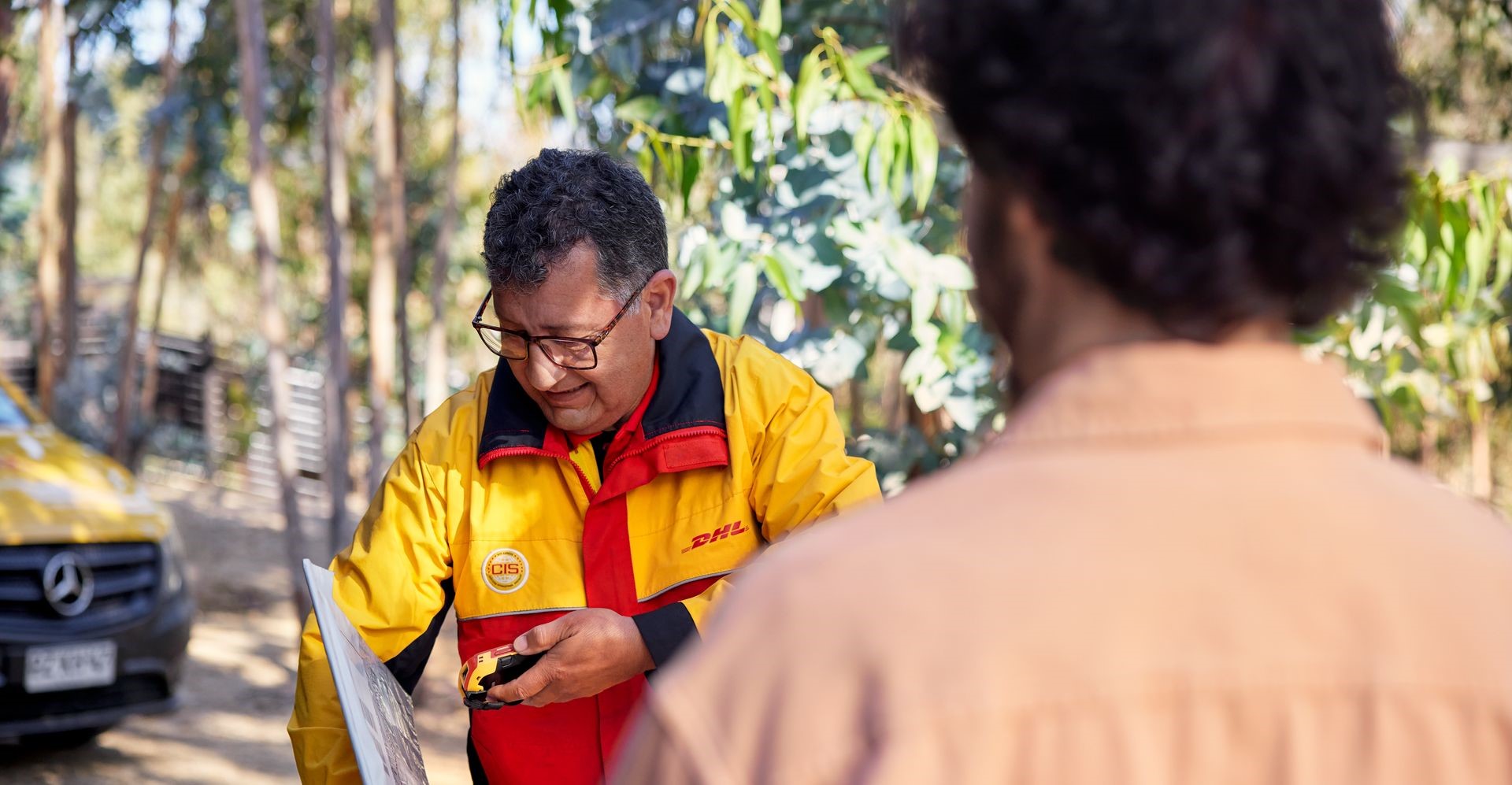 DHL Express employee doing a last-mile delivery to a remote location in the Philippines