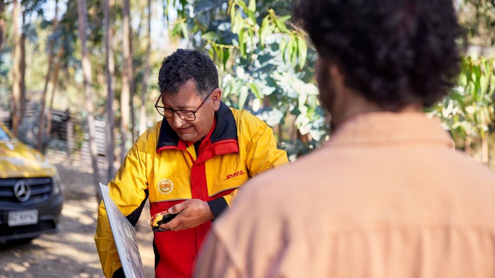 DHL Express employee doing a last-mile delivery to a remote location in the Philippines