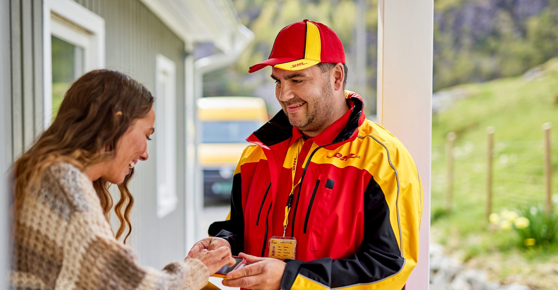 dhl express employee delivering parcel shipped from singapore to luxembourg