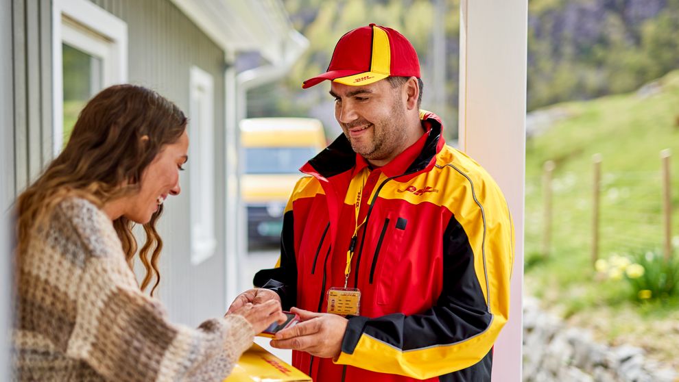 dhl express employee delivering parcel shipped from singapore to luxembourg